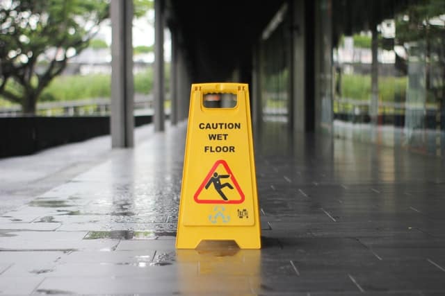 Wet floor sign placed outside of a building.