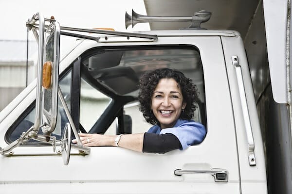 owner operator insurance woman truck smiling