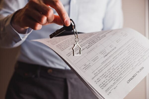 manager with rental property lease key